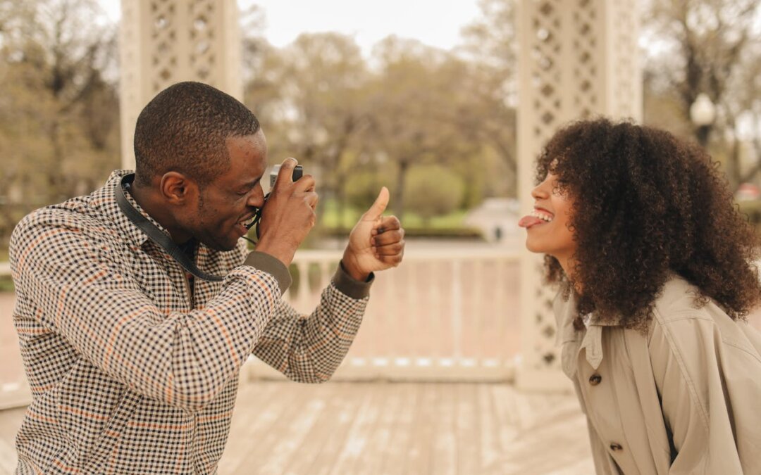 close-up-photo-of-man-taking-photo-of-a-woman