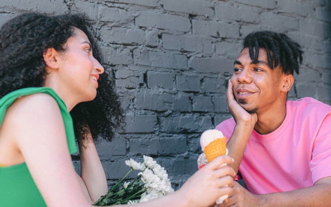 a-woman-and-a-man-talking-while-having-ice-cream