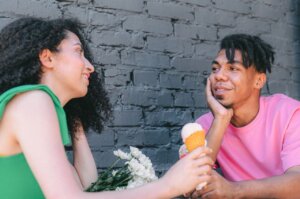 a-woman-and-a-man-talking-while-having-ice-cream