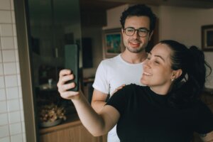 a-couple-taking-a-selfie-with-a-smartphone